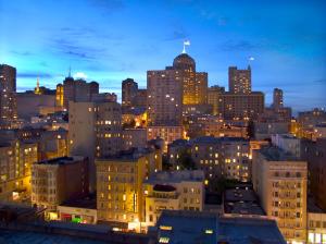a view of a city skyline at night at Kensington Park Hotel in San Francisco