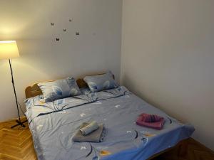 Postel nebo postele na pokoji v ubytování GOLD Apartman