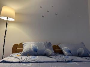 Postel nebo postele na pokoji v ubytování GOLD Apartman