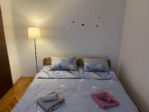 Postel nebo postele na pokoji v ubytování GOLD Apartman
