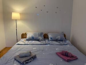 Postel nebo postele na pokoji v ubytování GOLD Apartman