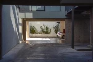 an entrance to a building with an open door at 3) Hermoso departamento cómodo y equipado! in Godoy Cruz