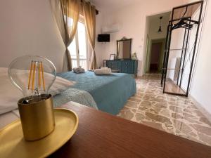 TV a/nebo společenská místnost v ubytování Le Gorgoni b&b