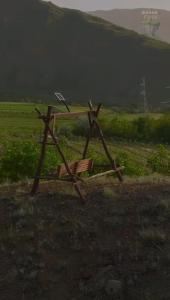 a wooden stand in the middle of a field at GreenField GH in Yeghegnadzor