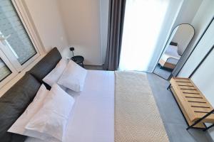 Postel nebo postele na pokoji v ubytování WEST BREEZE