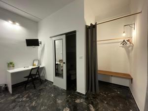 TV a/nebo společenská místnost v ubytování Le Gorgoni b&b
