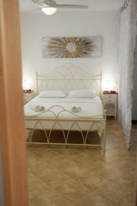 Postel nebo postele na pokoji v ubytování Avlemonas Guest House