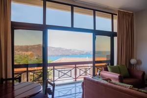 a living room with a view of the ocean at VistaMar - La Morada del Ocaso in Playa Hermosa