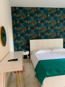 A bed or beds in a room at Casa Ammare