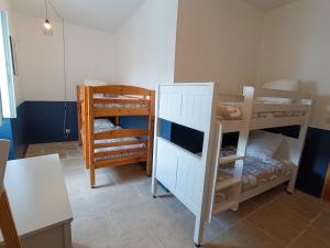 Un ou plusieurs lits dans un hébergement de l'établissement Maison de Village 18ème Siècle Familiale 3 Chambres