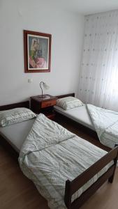 Una cama o camas en una habitación de Sobe Tanja