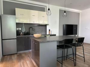 Kuchyň nebo kuchyňský kout v ubytování apartmán v Šamoríne + 3 fotografie