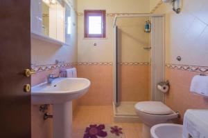 a bathroom with a sink and a toilet and a shower at Case Vacanze Dalisa Castagno Con Parcheggio in Tramonti +21 photos