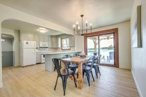 a kitchen and dining room with a table and chairs at Lakefront Wisconsin Getaway Fish, Boat, Relax! in Birnamwood