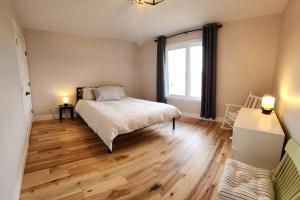 Cama o camas de una habitación en Chalet-en-bois-rond Log-home-house