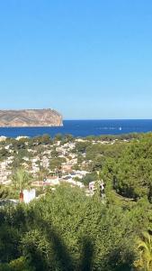 a view of a town with the ocean in the background at Casa El Sueño in Jávea