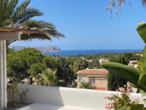 a view of the ocean from the balcony of a house at Casa El Sueño in Jávea