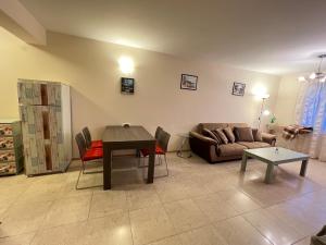 a living room with a couch and a table at Vista Residence Apartments in Sveti Vlas