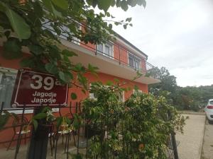 a building with a sign on the side of it at Apartment Nada in Izola