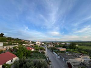 an aerial view of a town with a street at Vila Kasemi in Fier