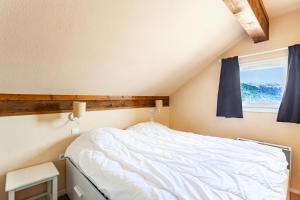 Tempat tidur dalam kamar di Résidence Le Thabor - maeva Home - Appartement 4 pièces 6 personnes - Sél 754