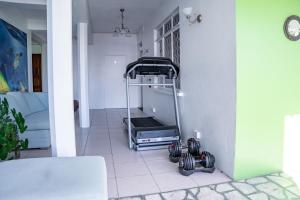 a treadmill sitting on a floor in a living room at Ocean's Edge Lodge Restaurant & Bar in Roseau