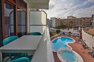 a balcony with a view of a swimming pool at APARTMENT FLAMINGO in Playa del Ingles