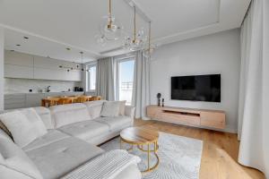 Telewizja i/lub zestaw kina domowego w obiekcie Blue Mandarin Marina