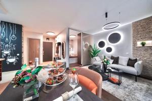 a living room with a couch and a table with food at One bed apartment at central location in Budapest in Budapest