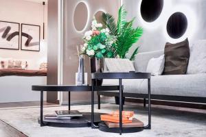 a living room with two tables and a couch at One bed apartment at central location in Budapest in Budapest