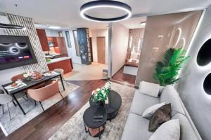 a living room with a couch and a table at One bed apartment at central location in Budapest in Budapest +21 photos