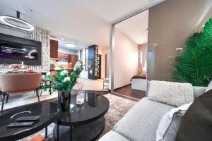 a living room with a couch and a table at One bed apartment at central location in Budapest in Budapest