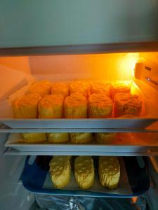 a refrigerator filled with lots of food at ferme pedagogique des pennetieres in Montcorbon