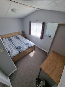 an overhead view of a bedroom with a bed and a window at Alberta holiday park in Whitstable