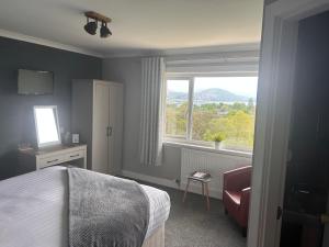 Postel nebo postele na pokoji v ubytování Braeburn Guesthouse