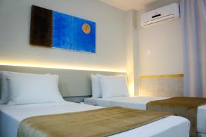 Postel nebo postele na pokoji v ubytování Smart Hotel João Pessoa