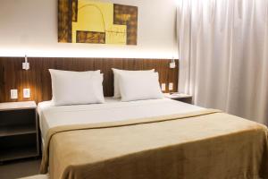 Postel nebo postele na pokoji v ubytování Smart Hotel João Pessoa