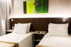 Postel nebo postele na pokoji v ubytování Smart Hotel João Pessoa
