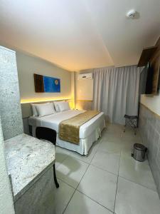 Postel nebo postele na pokoji v ubytování Smart Hotel João Pessoa