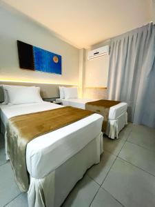 Postel nebo postele na pokoji v ubytování Smart Hotel João Pessoa