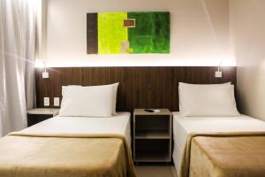 Postel nebo postele na pokoji v ubytování Smart Hotel João Pessoa