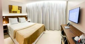 Postel nebo postele na pokoji v ubytování Smart Hotel João Pessoa