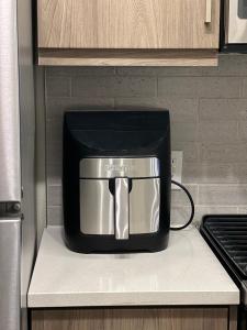 a black toaster sitting on a counter in a kitchen at 1 Bdr Apt in Irvine - Near John Wayne in Irvine
