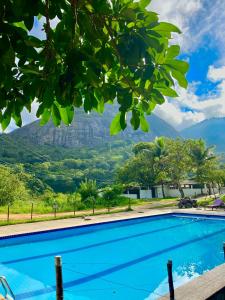 a swimming pool with a view of a mountain at FLAT 234 Hotel Pedra Rodeadouro in Bonito