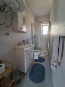Kúpeľňa v ubytovaní Apartmani Živković
