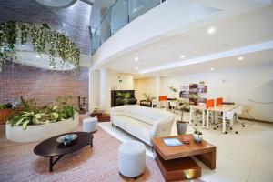 a living room with a couch and a table at Chairu Eco Hotel in Santa Cruz de la Sierra