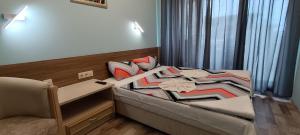 A bed or beds in a room at Europroperties Bendita Mare Apartments