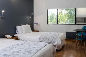 Postel nebo postele na pokoji v ubytování Hotel Nippon y Centro de Eventos + 24 fotografií