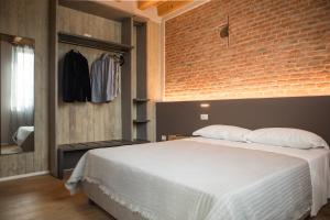 Postel nebo postele na pokoji v ubytování Residenza Castei