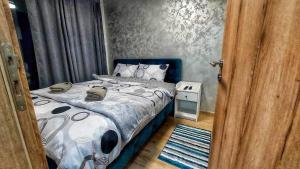 Postel nebo postele na pokoji v ubytování Green Hills MD Divcibare
